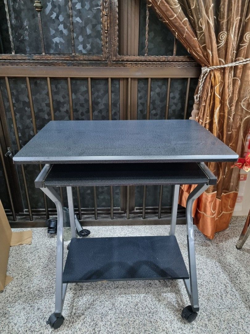 Computer Table (Category: Tables & Sets) located in Singapore. Submitted by shreddeduser (Listing ID 1321812029, Image 1). Description: Computer desk still in good condition. ( 20 × 27.5 × 28 ) Have abit of Minor Defect on the wood but overall still in good condition. Wheels and roller still in good conditon as well. Able to nego Self collection.