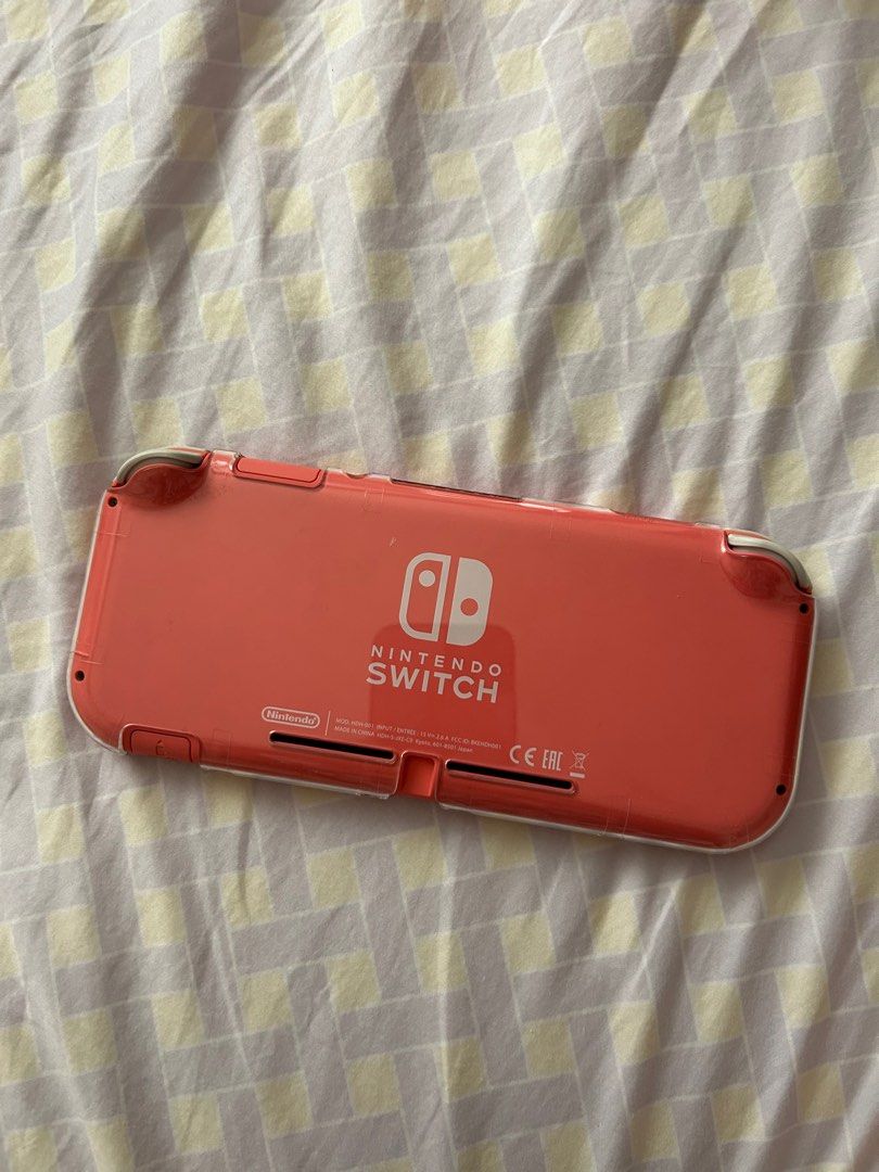 Nintendo Switch Lite - Coral Pink (Category: Nintendo) located in Quezon City. Submitted by poochiyena (Listing ID 1321716207, Image 2). Description: 9/10 condition ✨ bought last 2022 in datablitz rob mag no dents or scratches well taken care of by owner kept in protective case inclusion: clear case and box rfs: not using it anymore location: banawe, QC NO SWAPS.