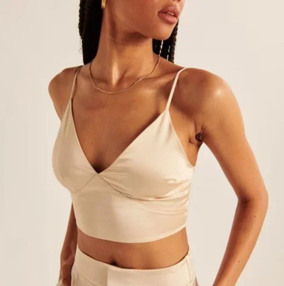 Champagne Cream Satin Crop Top (Category: Others Tops) located in Muntinlupa City. Submitted by bznic (Listing ID 1306152038, Image 1). Description: Washed but never used. Adjustable straps. Also available in Chocolate Espresso and Olive Green.