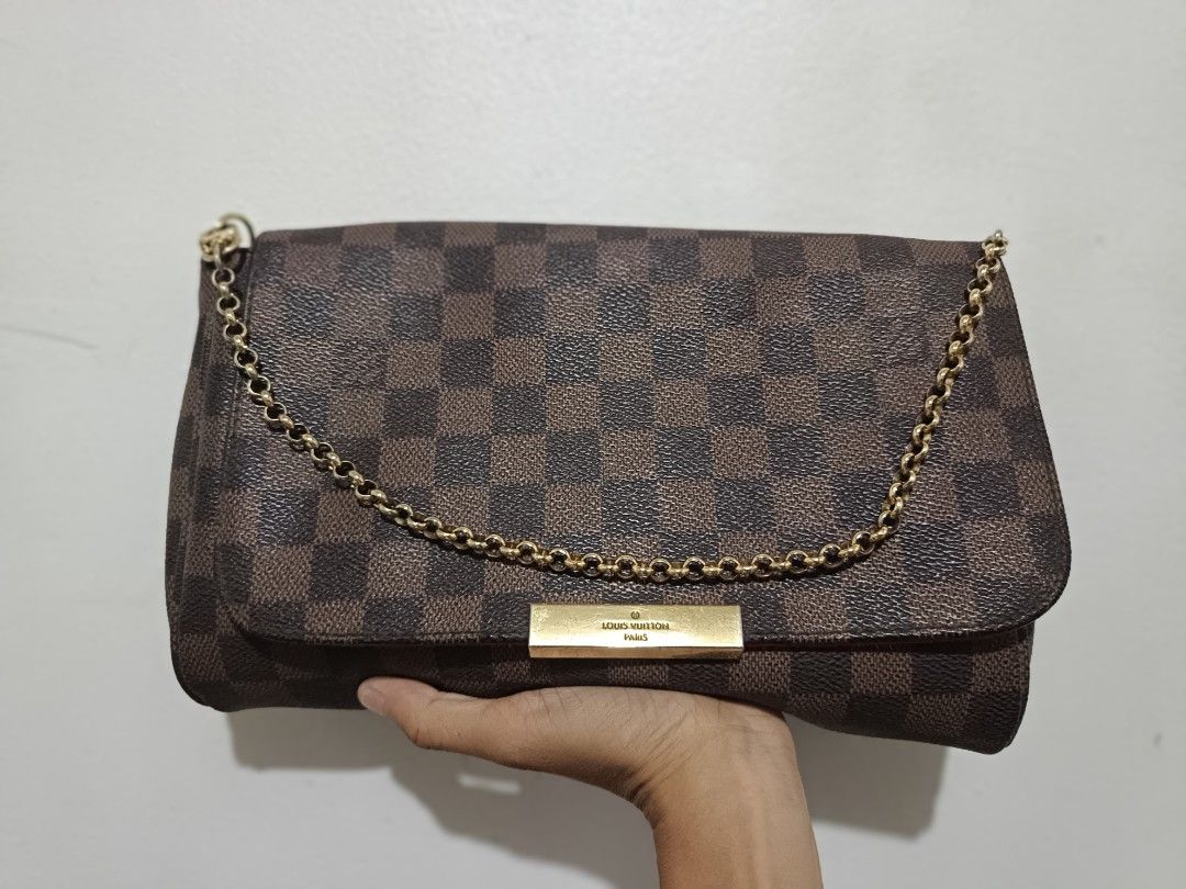 Louis Vuitton Damier Ebene Favorite MM (Category: Luxury Bags & Wallets) located in Malolos. Submitted by jerissemae (Listing ID 1321961565, Image 1). Description: Louis Vuitton Damier Ebene Favorite MM - RFS: nakatambak na lang. - no box. - no sling strap, nawala na. kaya hindi ma cross body na gamit, provide your own na lang. - not sure if original, will provide photos. Then you decide..