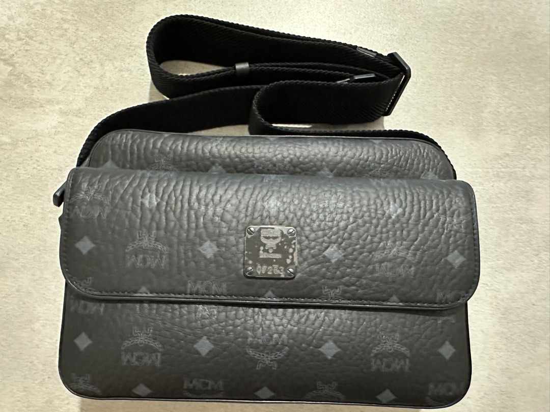MCM Aren messenger bag (Category: Bags & Wallets) located in Singapore. Submitted by raven_09 (Listing ID 1321940350, Image 1). Description: MCM Aren messenger bag Colour: Black Seldom use Refer to link: https://th.mcmworldwide.com/en_TH/men/bags/crossbody-and-messenger-bags/aren-messenger-bag-in-visetos/MMRDSTA01BK001.html?cgid=men-bags-messengers Once sold, item is non-refundable and non-exchangeable .