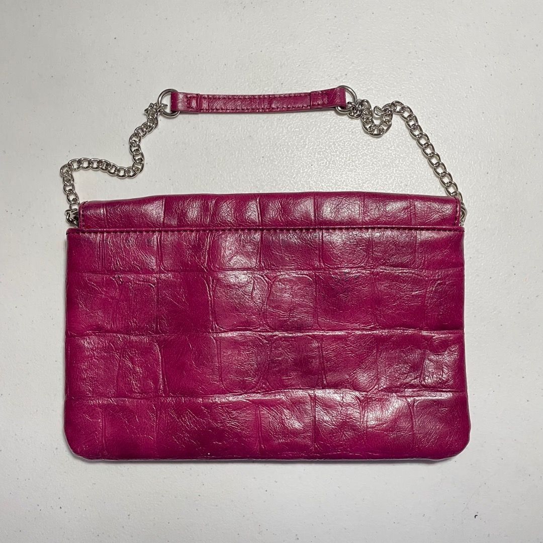 Nine West Clutch Burgundy (Category: Clutches) located in Quezon City. Submitted by jamillechua (Listing ID 1321878145, Image 2). Description: NEVER USED BUT HAS STAINS INSIDE (FROM STORAGE).
