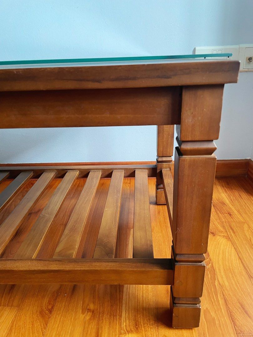 Solid Teak Coffee Table (Category: Tables & Sets) located in Singapore. Submitted by josettes (Listing ID 1321898168, Image 2). Description: Beautiful and sturdy teak coffee table (approx 30 kg) @$85 Customized thick glass top for additional $10 Please arrange your own movers. Collection at 532471.