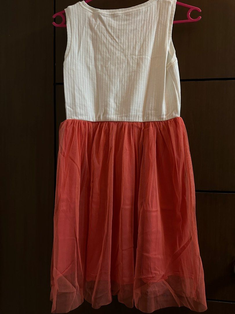 Uniqlo dress with tutu size 150 (Category: Babies & Kids Fashion) located in Manila. Submitted by trixiefaves (Listing ID 1321936021, Image 2). Description: Uniqlo dress with tutu size 150. Almost brand new. Never worn but washed. Length is 30” and width is 12”.