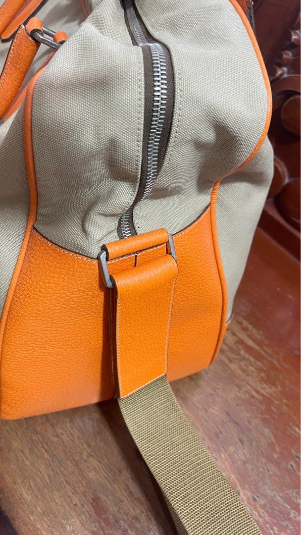 Authentic Prada travelling bag (Category: Luxury Bags & Wallets) located in Las Pinas. Submitted by tatz06 (Listing ID 1322026458, Image 2). Description: Guaranteed authentic. Personal owned bag. Have some little rubs in the edge but no open piping. Still in good condition. 17x8.5x13 in.