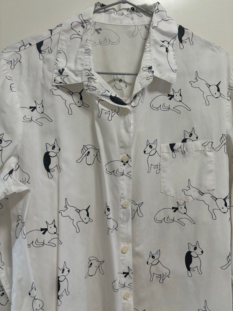 Dog print white longsleeves (Category: Longsleeves) located in Pasig City. Submitted by aac2021 (Listing ID 1322091386, Image 2). Description: RFS: Decluttering Dimension : Bustline - 40 inches Length - 32 inches .
