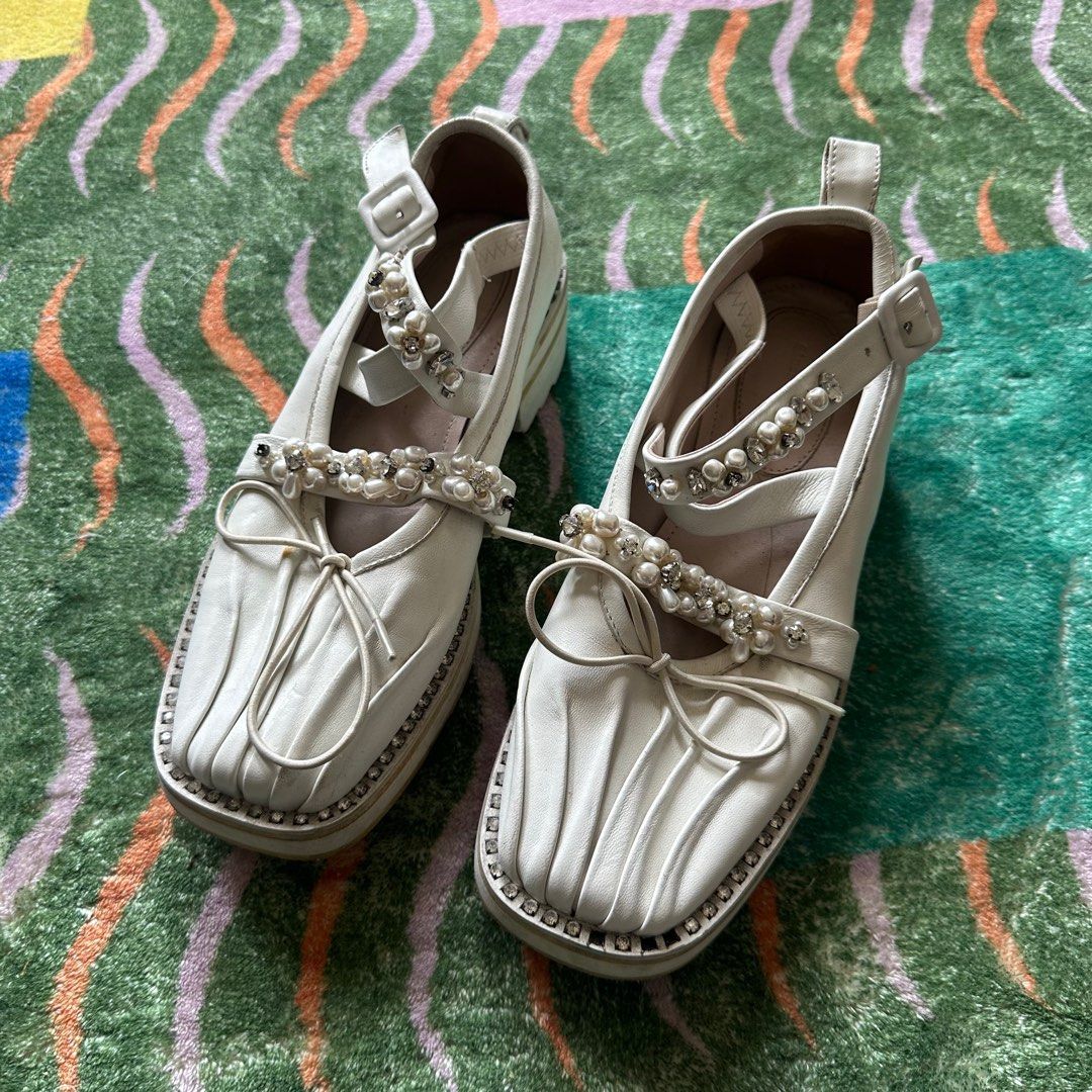 Authentic Simone Rocha White Mary Jane (Category: Heels) located in Mandaluyong City. Submitted by _decluttergirl._ (Listing ID 1322048576, Image 1). Description: Size: 35 Authentic Needs cleaning, natambak Has flaws Has 8 missing gems, needs replacement on some parts of the shoes. Looks like normal gems lang siya, pwede mapalitan Very gorgeous, just don’t fit me anymore :(.