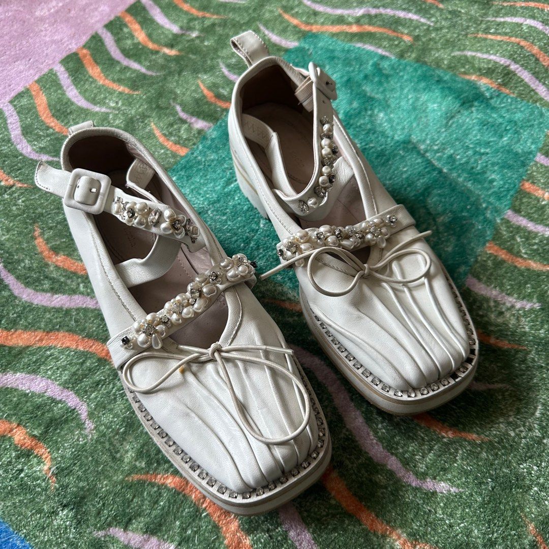Authentic Simone Rocha White Mary Jane (Category: Heels) located in Mandaluyong City. Submitted by _decluttergirl._ (Listing ID 1322048576, Image 2). Description: Size: 35 Authentic Needs cleaning, natambak Has flaws Has 8 missing gems, needs replacement on some parts of the shoes. Looks like normal gems lang siya, pwede mapalitan Very gorgeous, just don’t fit me anymore :(.