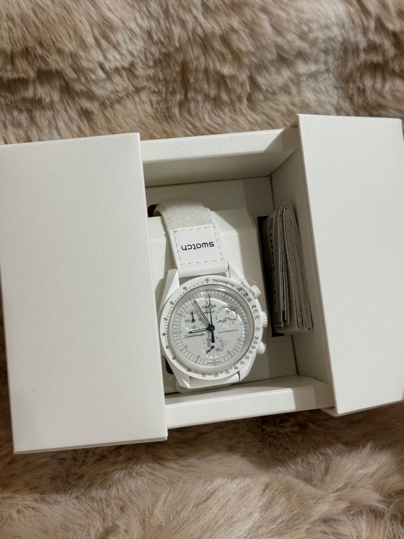 Swatch x Omega (Category: Women's Watches) located in Quezon City. Submitted by luxury.xy (Listing ID 1322116863, Image 2). Description: 100% authentic Germany bought Limited edition Swatch x Omega x Snoopy Complete inclusion.