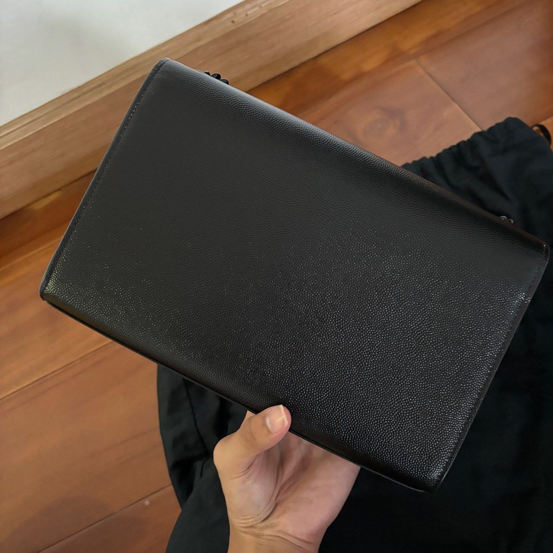 YSL Kate in Medium (Category: Luxury Bags & Wallets) located in Paranaque City. Submitted by booksandbeyond (Listing ID 1322122890, Image 3). Description: YSL Kate in medium all black -Condition 8.5/10 -Used but not abused -Comes with full set paper bag , dust bag, cards.