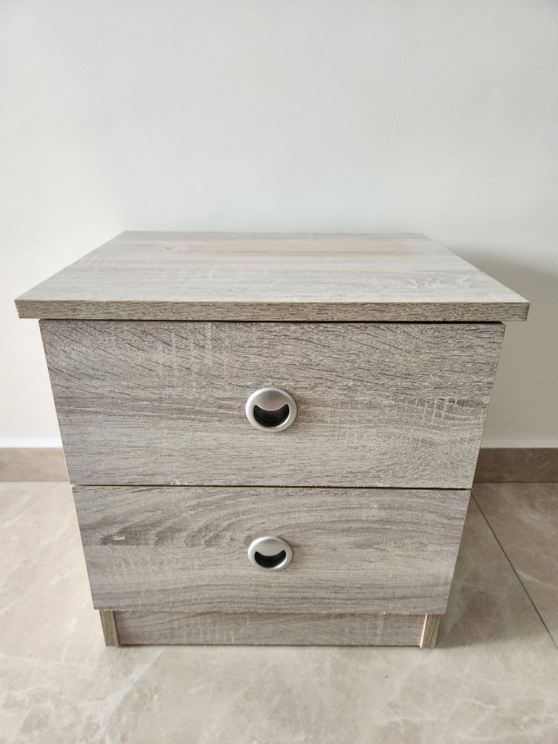 Bedside table (Category: Tables & Sets) located in Singapore. Submitted by transformerz (Listing ID 1322206815, Image 1). Description: Solid bedside table. Small mark at the top and a small chip on the bottom right as shown in the pictures..
