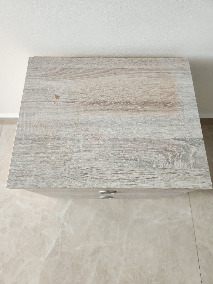 Bedside table (Category: Tables & Sets) located in Singapore. Submitted by transformerz (Listing ID 1322206815, Image 3). Description: Solid bedside table. Small mark at the top and a small chip on the bottom right as shown in the pictures..
