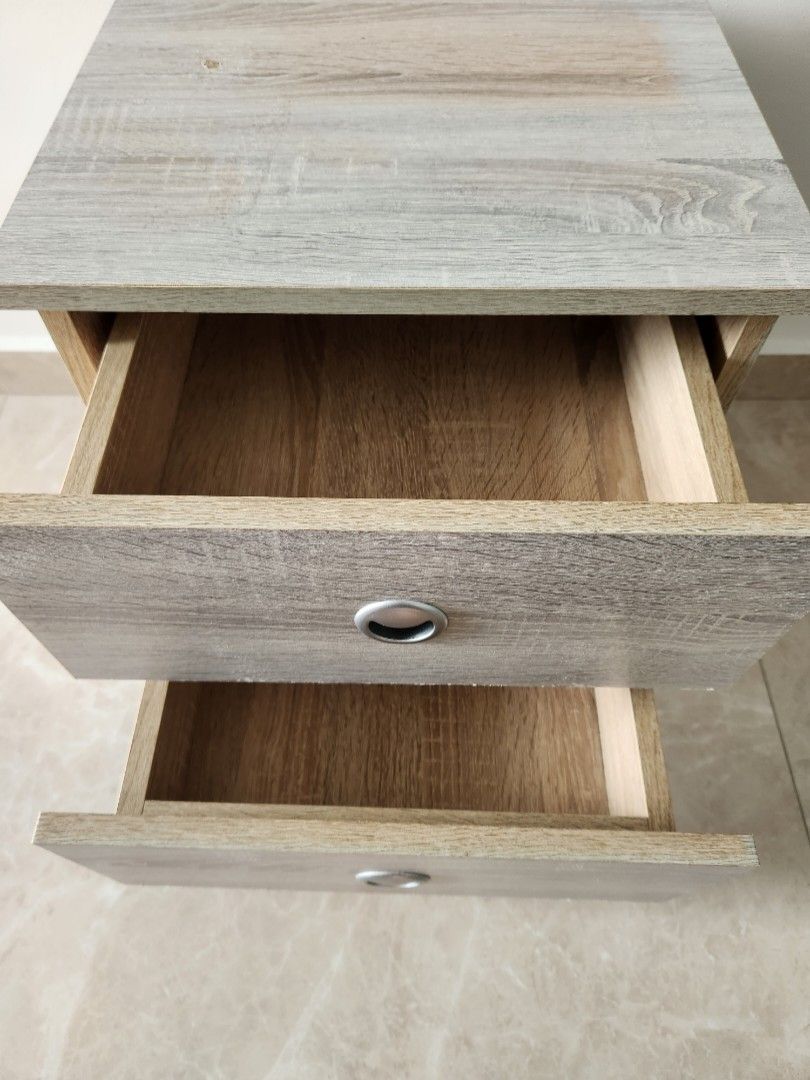 Bedside table (Category: Tables & Sets) located in Singapore. Submitted by transformerz (Listing ID 1322206815, Image 2). Description: Solid bedside table. Small mark at the top and a small chip on the bottom right as shown in the pictures..