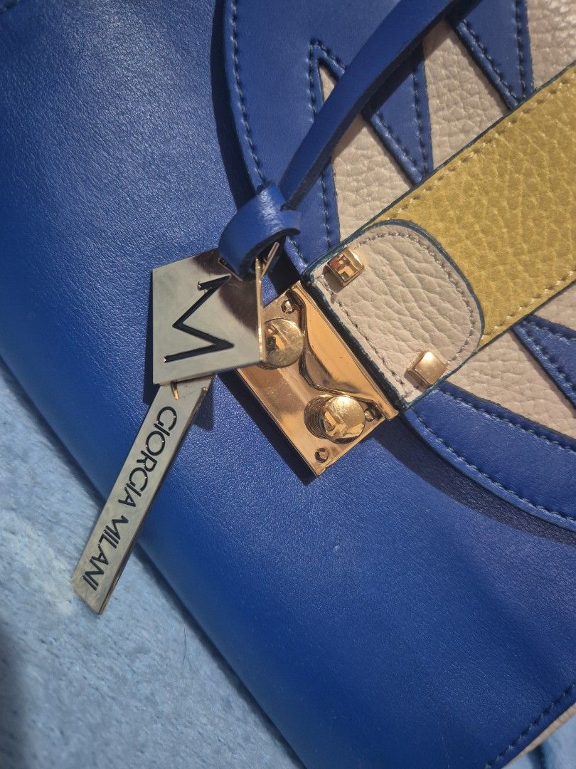 Giorgia Milani Small Top Handle Bag (Category: Luxury Bags & Wallets) located in Valenzuela. Submitted by randomlyn (Listing ID 1322235576, Image 2). Description: authentic Giorgia Milani bag gift from us slight scratch on the lock but hardware still shiny genuine leather negotiable.