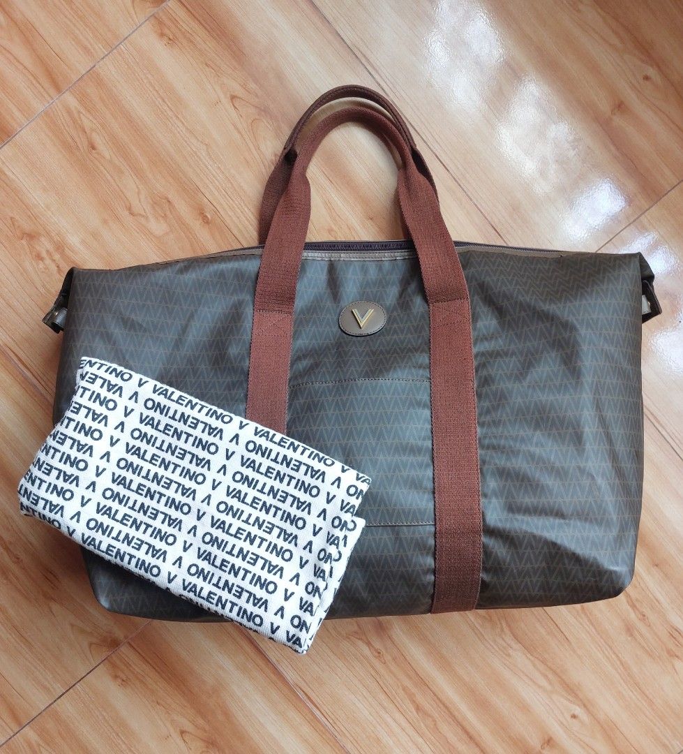 Mario Valentino travel bag (Category: Luxury Bags & Wallets) located in Davao. Submitted by wengbagstuff (Listing ID 1322266185, Image 1). Description: 🍀 vintage monogram pvc bag 🍀 light signs of usage 🍀 no bubbles, tear or holes 🍀 can be a travel bag or large tote bag.