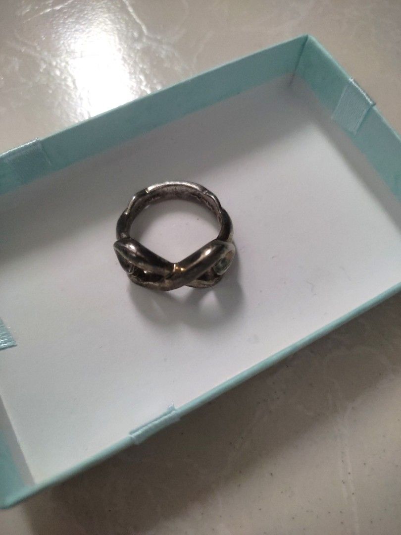 Original! Tiffany & Co. Infinity Silver Ring (Category: Rings) located in Las Pinas. Submitted by bibliomomma (Listing ID 1322237388, Image 1). Description: Guaranteed Authentic! Tiffany & Co. Infinity Ring Original receipt uploaded for your reference Excellent used condition, just needs cleaning Size 6 Money back guarantee if proven fake MOP Gcash.
