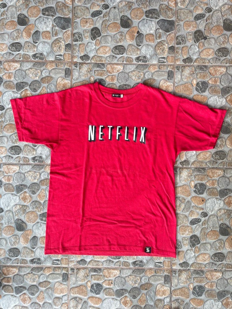 SPECTEECULAR MANILA NETFLIX TEE (Category: Tshirts & Polo Shirts ) located in Pasig City. Submitted by thriftzzsweep (Listing ID 1322301857, Image 1). Description: SPECTEECULAR MNL NETFLIX TEE ISSUE: NEED WASH COLOR RATE: 9 CONDITION: 8 SIZE ON TAG: L WIDTH: 20 LENGTH: 26 DETAILS: PRINTED TEE.