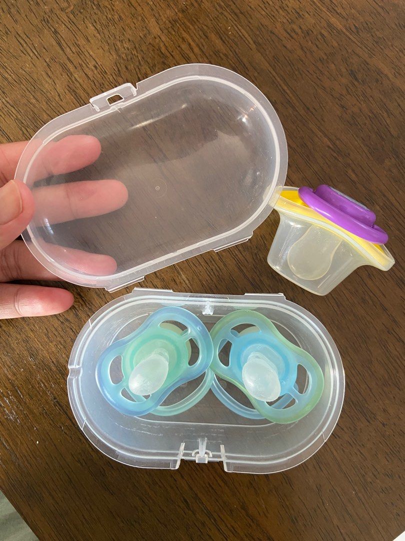 TAKE ALL USED Avent and Tiny Buds Night Pacifier (Category: Soothers & Pacifiers) located in Bulacan. Submitted by declutzy (Listing ID 1322233115, Image 2). Description: TAKE NOTE THAT THIS IS ALREADY USED ITEM 1 Original Avent Pacifiers Glow in the Dark with broken case (still working) 1 Tiny Buds Night Pacifier with Case This is used pacifiers Sign of water sterilization I tried to give my baby paci but he doesn’t like pacifiers BUY AT YOUR OW