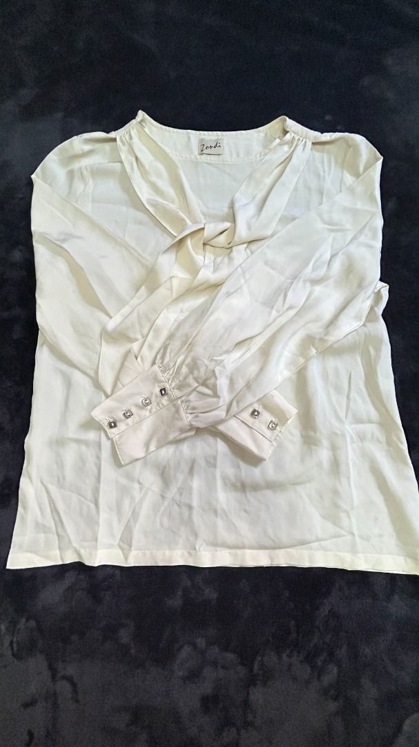 Womens Off-White Silk Long Sleeves Blouse (Category: Blouses) located in Pasay City. Submitted by mgagamitnichrish (Listing ID 1322318995, Image 2). Description: Size: Best fit Medium-Large Condition: Pre-loved but still in great condition 📍Pasay MOD: Lalamove or Grab Issue: small ballpen stain on collar part. please check the last image .