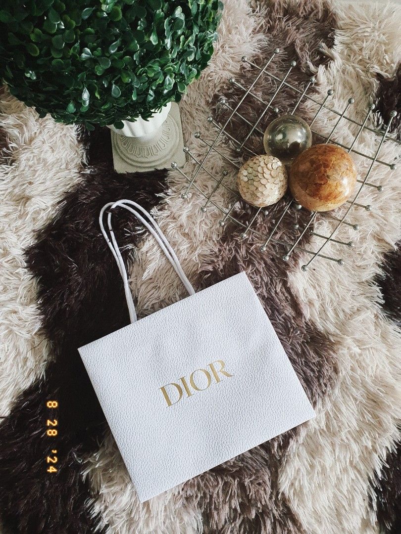 AUTHENTIC DIOR GIFT PAPER BAG (Category: Luxury Accessories) located in Manila. Submitted by outerwearsmanila (Listing ID 1322405922, Image 1). Description: Description ❤️ PRELOVED ❤️ Guarantee Authentic 💯 * Dior. paper bag. . * condition is excellent. . * size is 27×23×11.5cm. . * thickness . paper made ., robust.
