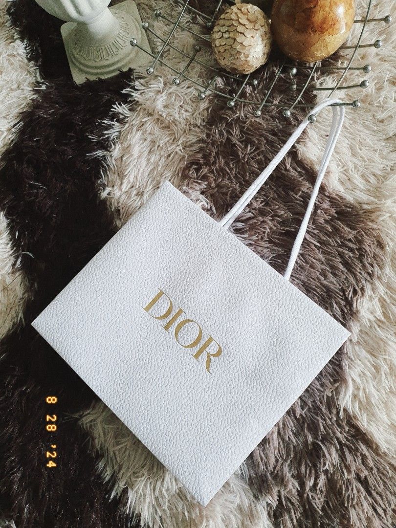 AUTHENTIC DIOR GIFT PAPER BAG (Category: Luxury Accessories) located in Manila. Submitted by outerwearsmanila (Listing ID 1322405922, Image 2). Description: Description ❤️ PRELOVED ❤️ Guarantee Authentic 💯 * Dior. paper bag. . * condition is excellent. . * size is 27×23×11.5cm. . * thickness . paper made ., robust.