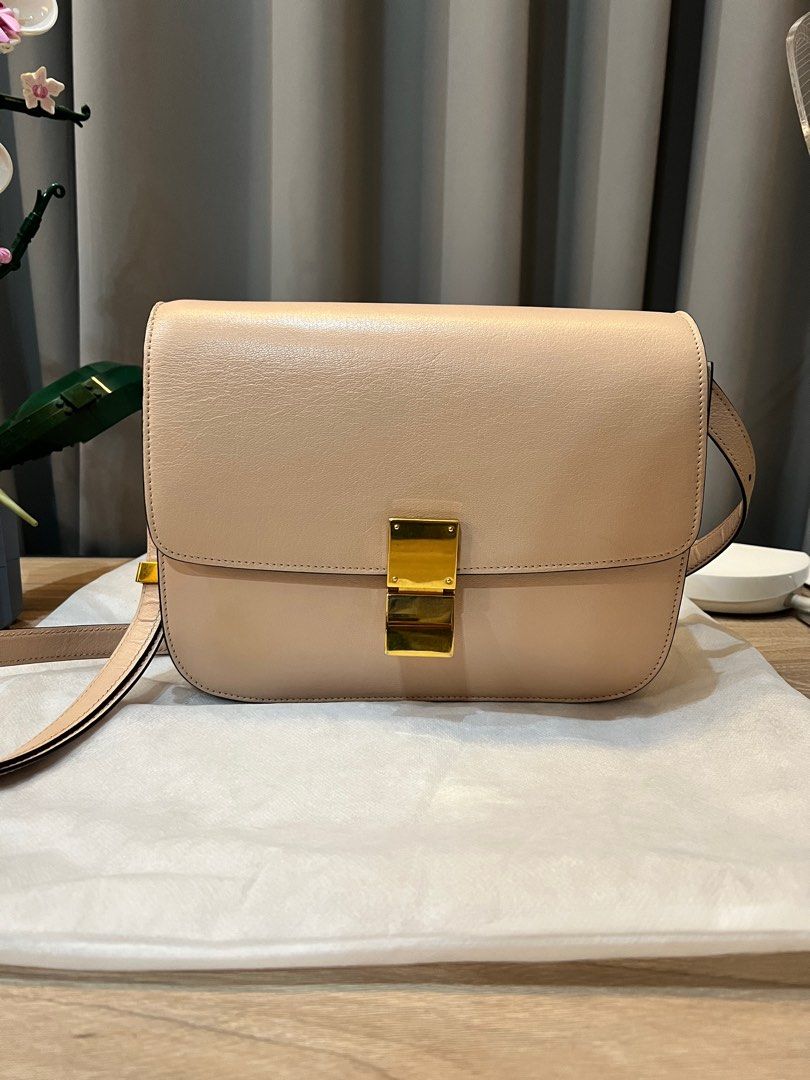 CELINE (Auth) Classic Box Shoulder Sling Bag, Medium, Nude (Category: Luxury Bags & Wallets) located in Pasig City. Submitted by theclosetcasemanila (Listing ID 1322534362, Image 1). Description: Guaranteed Authentic The must have classic Celine box bag in this chic neutral shade that matches everything!! No flaws. Super nice natural color. Leather is clean and has no major scratches Signs of light wear but no major issues. Excellent condition Ad