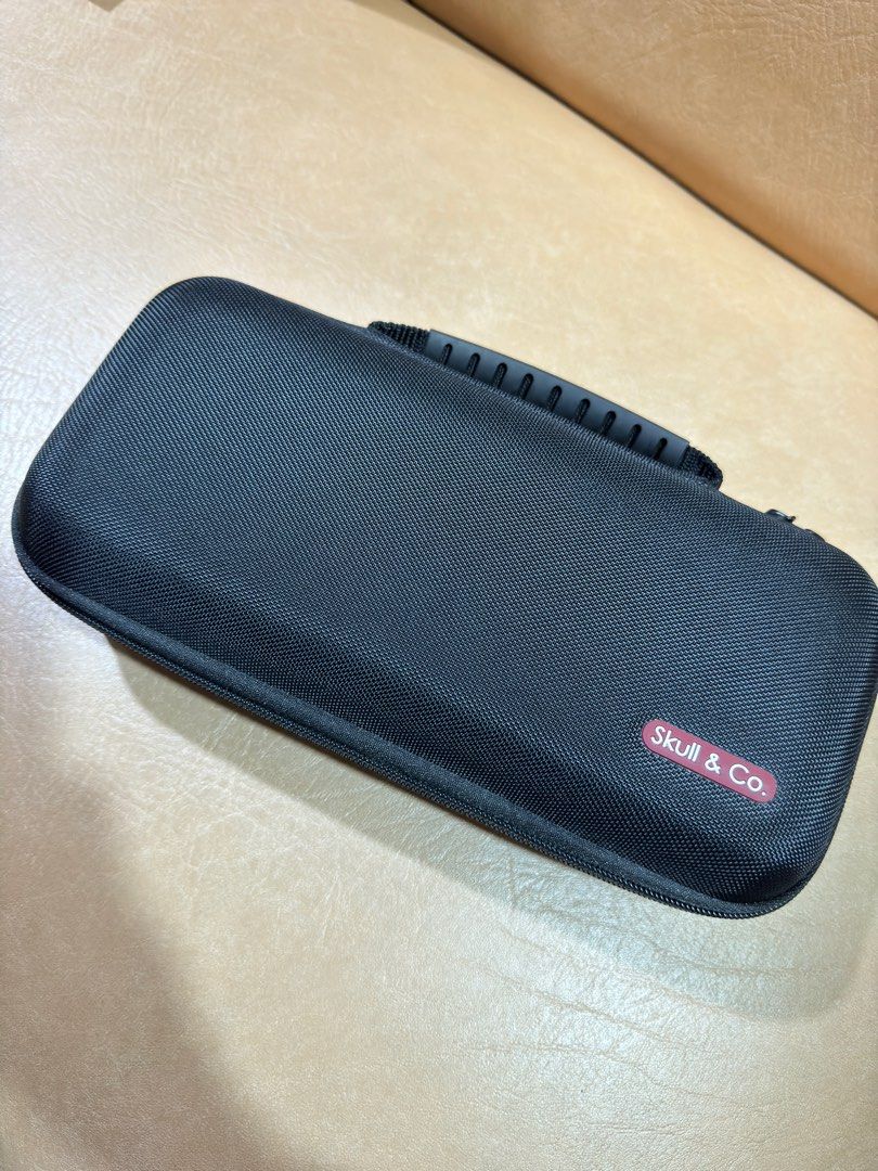 Skull & Co Nintendo Switch Case with Free Grip (Category: Cases & Covers) located in Manila. Submitted by vintageluxefinder (Listing ID 1322507904, Image 1). Description: Nintendo Switch Case with Game compartments and free skull and co grip as well Rfs: wala na ako switch haha.