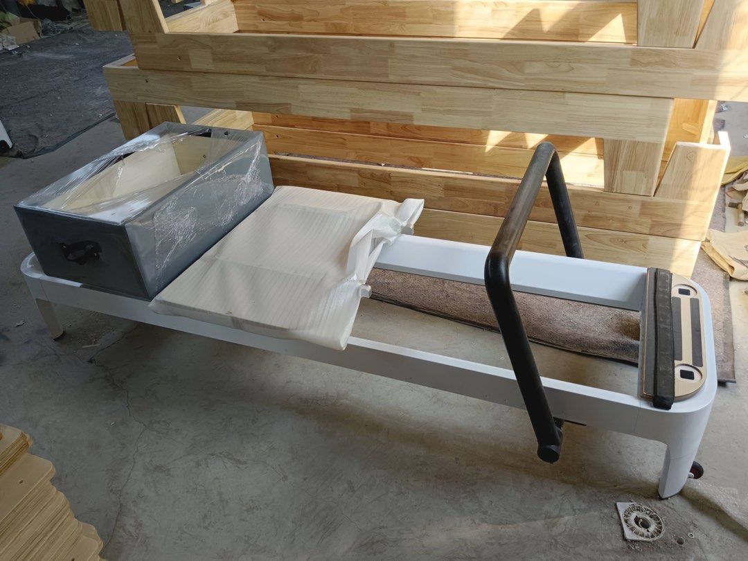 Pilates Reformer Studio Grade (Category: Cardio & Fitness Machines) located in Quezon City. Submitted by jasminelorrainelim (Listing ID 1322617176, Image 2). Description: *studio grade * US and EU quality * powder coated aluminum, rust resistant * sitting box, jump board, footstrap * infinity foot bar * removable shoulder blocks * Piano wire spring (no rust, no sound) * 3 red, 1 blue, 1 yellow springs * Microfiber Leather (non slip, wear resistan