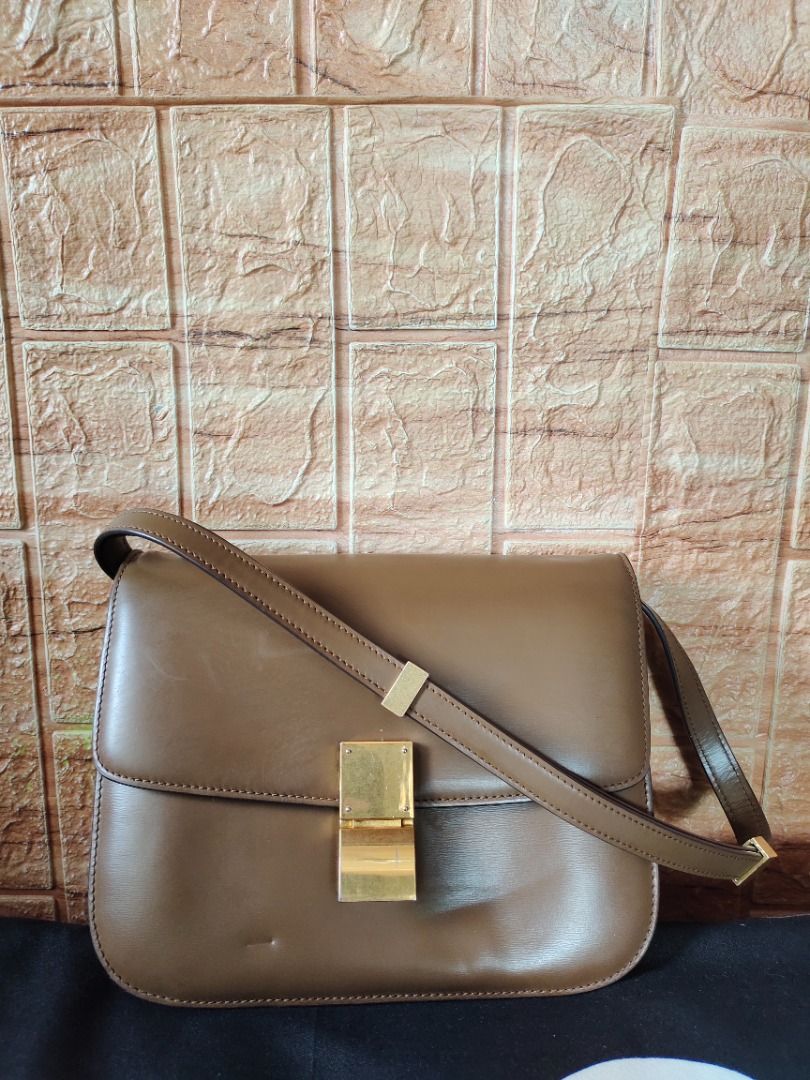 Celine Classic Box Bag (Authentic) (Category: Luxury Bags & Wallets) located in Caloocan City. Submitted by roxy420 (Listing ID 1322630773, Image 2). Description: Camel Brown Smooth Calfskin Leather Detachable and adjustable shoulder strap Antiqued Gold toned hardware Condition: Great Condition. The exterior leather surface has signs of usage with some light marks. The strap is in excellent condition. The interior looks new. Authenticity Guarante