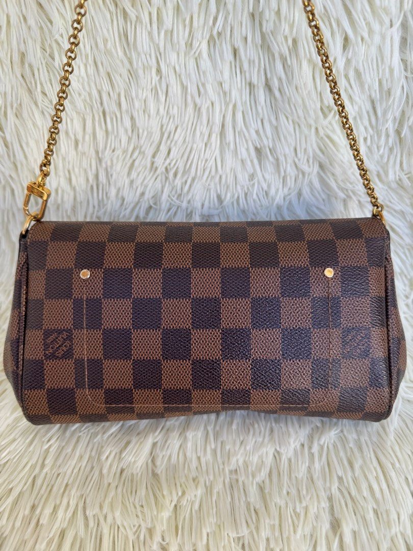 LV Favorite PM Damier Ebene (Category: Luxury Bags & Wallets) located in Las Pinas. Submitted by Le.Pattie.Luxe (Listing ID 1322736510, Image 3). Description: 💯% authentic RARE✨𝐋𝐕 𝐅𝐚𝐯𝐨𝐫𝐢𝐭𝐞 𝐏𝐌 𝐃𝐚𝐦𝐢𝐞𝐫 𝐄𝐛𝐞𝐧𝐞 🤎𝐏𝐡𝐩 𝟔𝟑𝐤🤎 ▪️8.6/10 condition, w/ minor scratches on the metal plate ▪️Can be worn as clutch, crossbody, short/long shoulder bag ▪️Inclusions: detachable strap, dustbag, & certificate of authenticity from LegitGrai