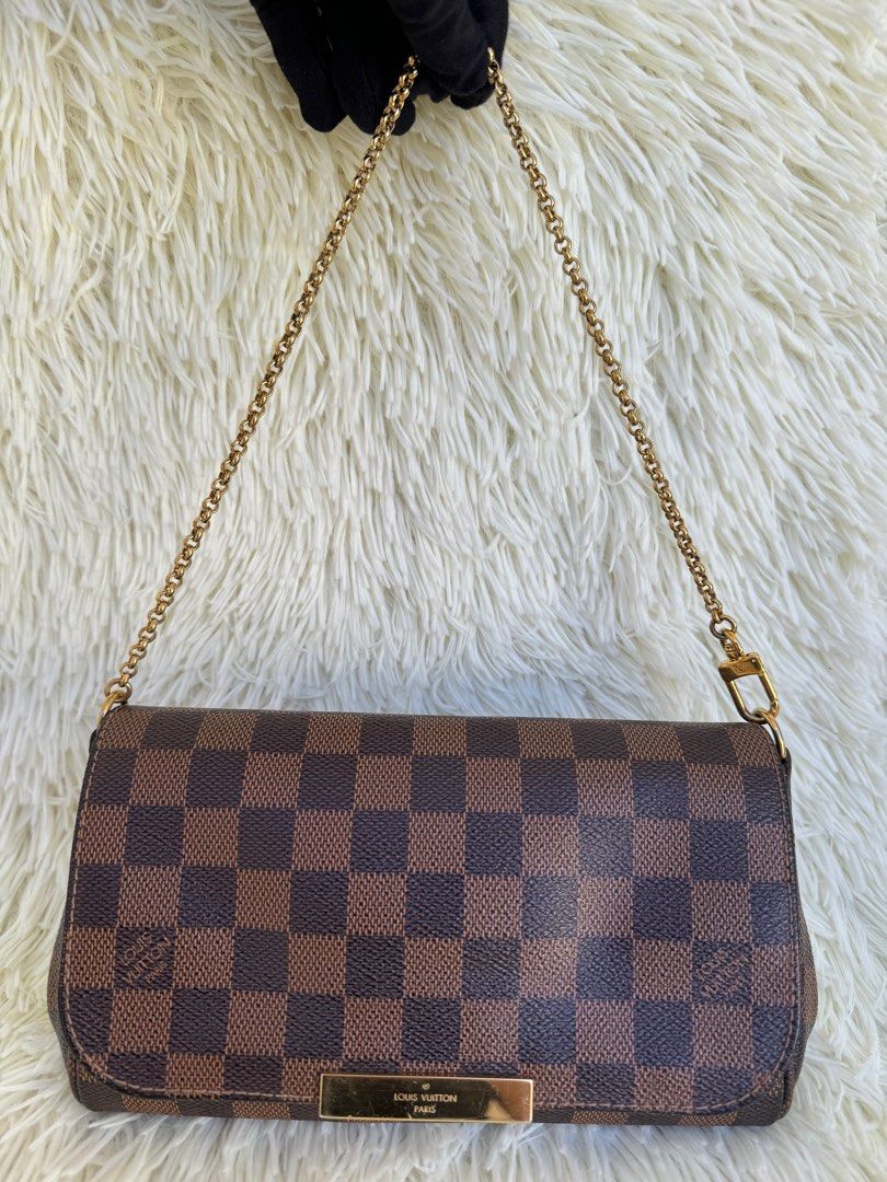 LV Favorite PM Damier Ebene (Category: Luxury Bags & Wallets) located in Las Pinas. Submitted by Le.Pattie.Luxe (Listing ID 1322736510, Image 2). Description: 💯% authentic RARE✨𝐋𝐕 𝐅𝐚𝐯𝐨𝐫𝐢𝐭𝐞 𝐏𝐌 𝐃𝐚𝐦𝐢𝐞𝐫 𝐄𝐛𝐞𝐧𝐞 🤎𝐏𝐡𝐩 𝟔𝟑𝐤🤎 ▪️8.6/10 condition, w/ minor scratches on the metal plate ▪️Can be worn as clutch, crossbody, short/long shoulder bag ▪️Inclusions: detachable strap, dustbag, & certificate of authenticity from LegitGrai