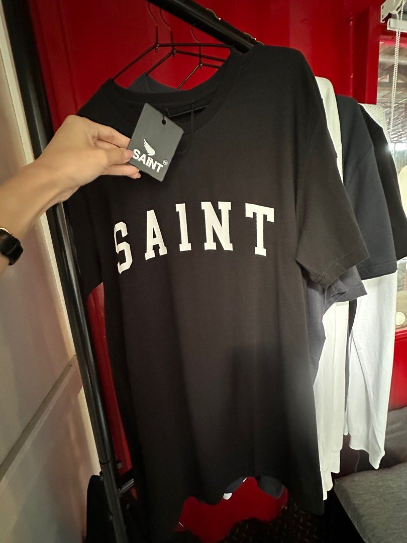 SA1NT Merch (Category: Tshirts & Polo Shirts ) located in Paranaque City. Submitted by listitwithb (Listing ID 1322587379, Image 3). Description: SA1NT MERCH Selling as set only. All brand new and with tags. What you will get: 6pcs Saint Shirts - 4 Large - 2 XL 2pcs XL longsleeves 2pcs Balaclava SRP: ₱1999-₱2599 each ‼️selling as bulk way below cost: ₱6000 only .
