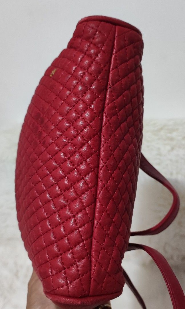 BALLY 🇯🇵👜 (Category: Luxury Bags & Wallets) located in Cavite. Submitted by yerbua103 (Listing ID 1318050790, Image 3). Description: 👉Authentic Bally semi-quilted bag in red leather. It features a leather and chain sling. Exterior has an open pocket with the B logo on the lower right side. Signs of used are visible. 👛Manage your expectations as you're buying preloved items so anticipate signs of wear. Details are posted. Check each of the ph