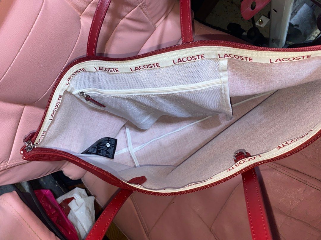 Lacoste Tote Bag. Authentic. 2,500 (Category: Luxury Bags & Wallets) located in Pasay City. Submitted by madelinefashionshop (Listing ID 1317906376, Image 2). Description: Bought from US Pasabuy Loc: Pasay Good condition / Good as new Rfs: Need funds Pm for interested buyer only.