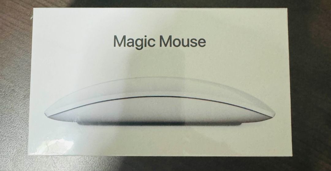 Magic Mouse (Authentic) (Category: Mouse & Mousepads) located in Singapore. Submitted by west.district (Listing ID 1318031572, Image 1). Description: Magic Mouse is wireless and rechargeable, with an optimized foot design that lets it glide smoothly across your desk. The Multi-Touch surface allows you to perform simple gestures such as swiping between web pages and scrolling through documents. USB-C to Lightning Cable. Bluetooth-enabled Mac with 