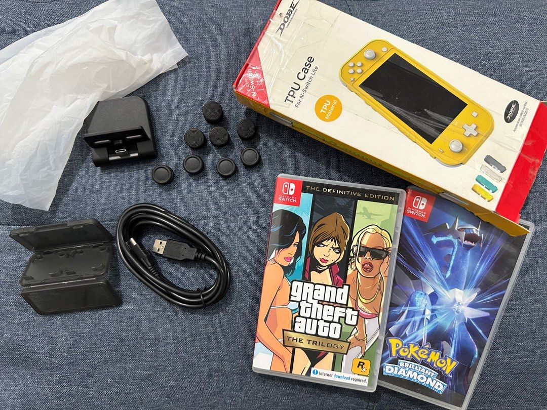Nintendo Switch Lite (yellow) (Category: Nintendo) located in Binan City. Submitted by badooo (Listing ID 1317876759, Image 3). Description: Negotiable! Lady-owned Nintendo game: Pokemon and GTA Trilogy No issue You can test all you want With free carrying Pouch (black) .