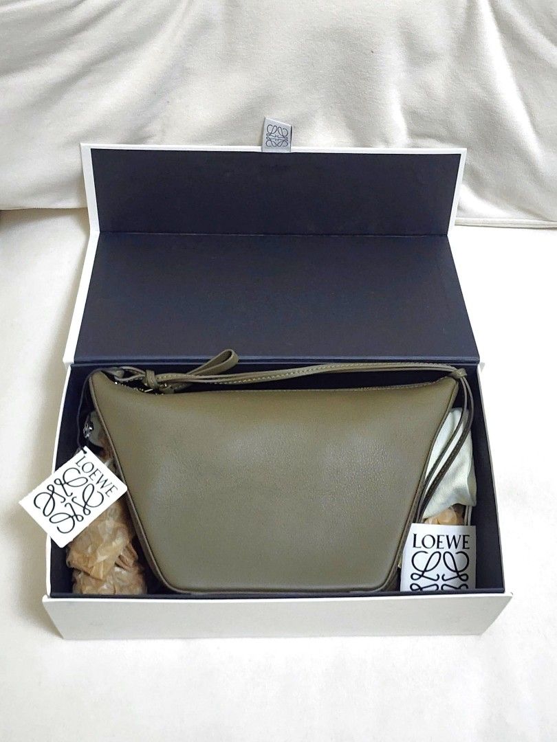 Ĺoewe 2-in-1 Mini Hammock Hobo Bag (Category: Luxury Bags & Wallets) located in Quezon City. Submitted by queentana_finds (Listing ID 1318050575, Image 1). Description: Brand new. Never been used. No damage at all. Bought it in Paris. With box, dustbag, care manual, long strap. Color is Dark Khaki. It can be worn as a hobo bag or a hammock bag. It can be worn as shoulder bag (short strap) or Crossbody (long strap). Market price outside is Php 134