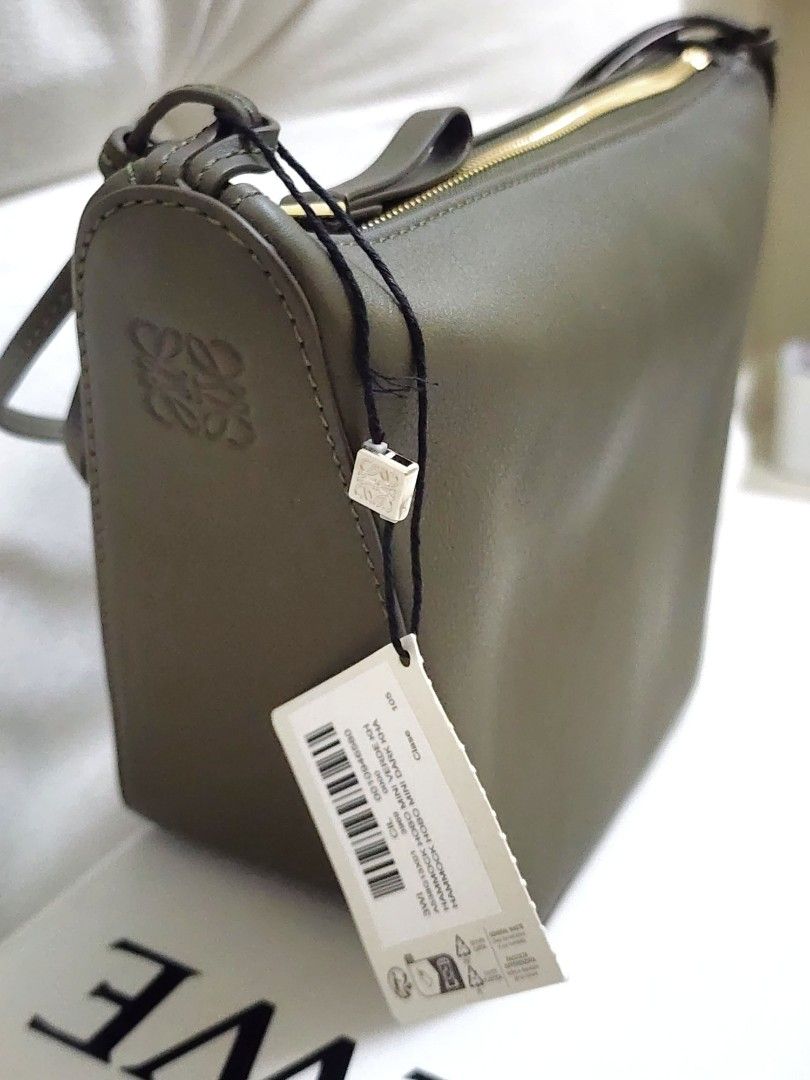 Ĺoewe 2-in-1 Mini Hammock Hobo Bag (Category: Luxury Bags & Wallets) located in Quezon City. Submitted by queentana_finds (Listing ID 1318050575, Image 2). Description: Brand new. Never been used. No damage at all. Bought it in Paris. With box, dustbag, care manual, long strap. Color is Dark Khaki. It can be worn as a hobo bag or a hammock bag. It can be worn as shoulder bag (short strap) or Crossbody (long strap). Market price outside is Php 134