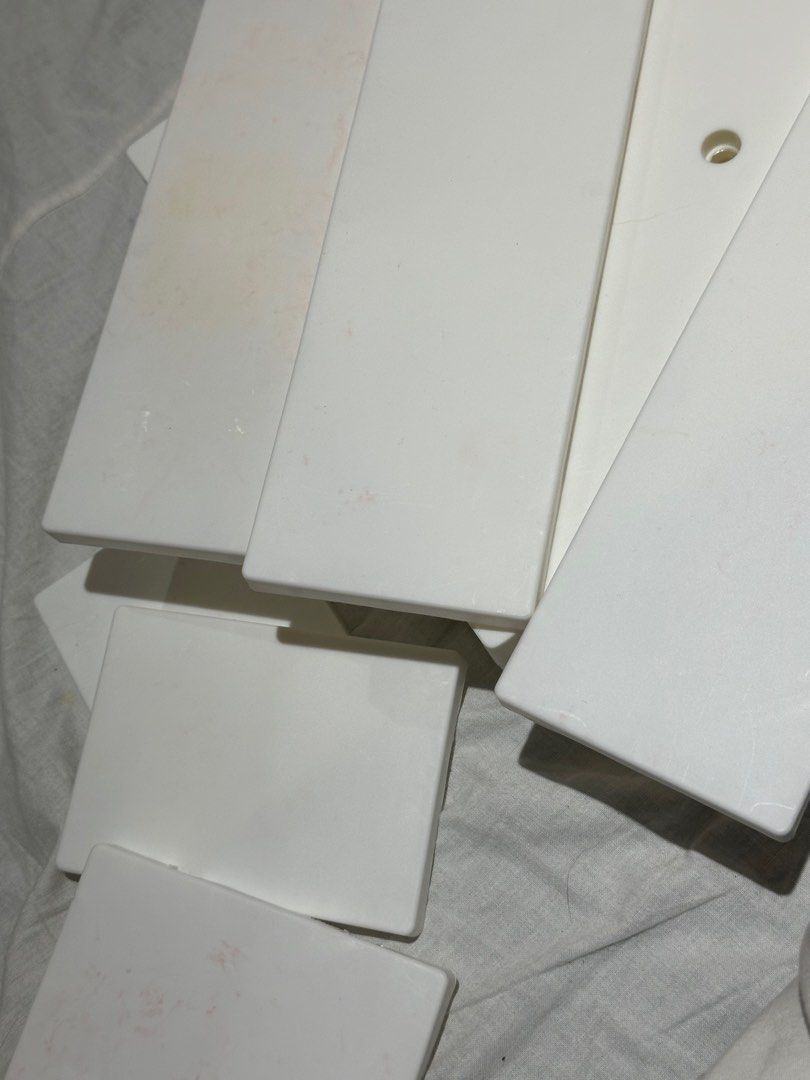 Pegboard - Storage Rack Hole Board Shelf with hanging hooks (Category: Storage Boxes & Baskets) located in Taguig. Submitted by chrryblssmhvn (Listing ID 1312641127, Image 3). Description: 3 pieces white pegboard, as is medyo may stain ung ibang parts dahil sa pinatong kong scented candle 22x22cm used adhesive. magbigay nlng ako extra adhesive na nano tape :).
