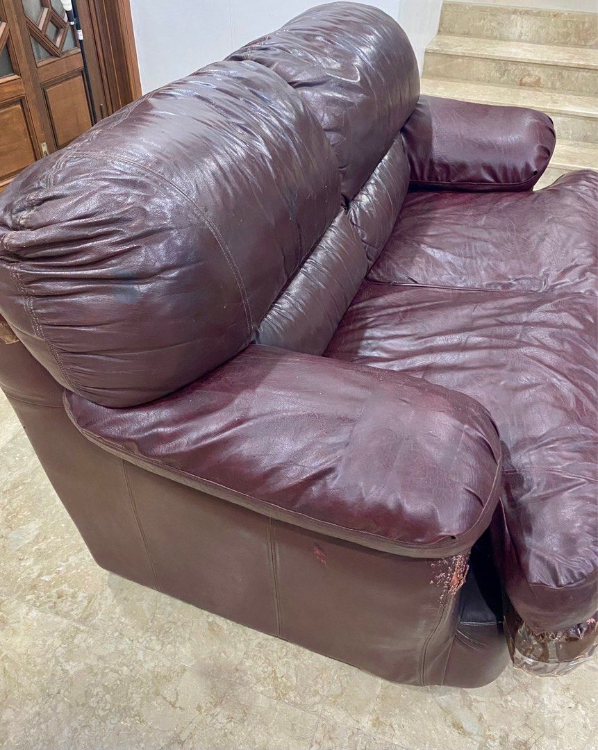 Brown/Maroon German Leather 2seater Sofa (Category: Sofas) located in Quezon City. Submitted by hellodiva (Listing ID 1322805807, Image 3). Description: German Real Leather (di nagbakbak) Size: L 68” x W 40” x H 19” (seat) Very Comfortable. Timeless. Classic. Durable. Issues: Wear & Tear on some parts of leather (backrest). Some scratches on corners of sofa due to cat (rehomed). Can be reupholstered for new leather. RFS: Decluttering. We are keep