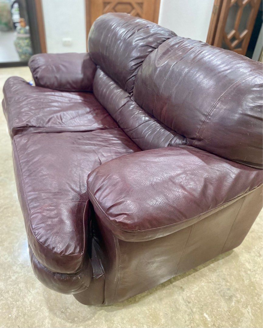 Brown/Maroon German Leather 2seater Sofa (Category: Sofas) located in Quezon City. Submitted by hellodiva (Listing ID 1322805807, Image 1). Description: German Real Leather (di nagbakbak) Size: L 68” x W 40” x H 19” (seat) Very Comfortable. Timeless. Classic. Durable. Issues: Wear & Tear on some parts of leather (backrest). Some scratches on corners of sofa due to cat (rehomed). Can be reupholstered for new leather. RFS: Decluttering. We are keep