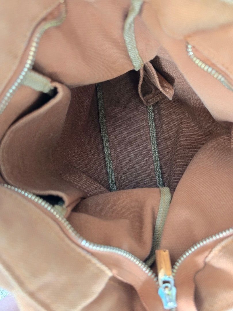 Canvas Club - Casual Canvas (Rust) (Category: Tote Bags) located in Makati City. Submitted by l.declutter (Listing ID 1322768972, Image 3). Description: - Barely used - Very spacious, can be used as a school or office bag - A bit faded but overall in good condition - Current retail price is Php 1,450.00 - Shipping c/o buyer 🚚 Product details: - H: 11.5" / L: 15" / base: 3" - Thick canvas fabric - Zipper closure - Strap drop length: 16" - With bo