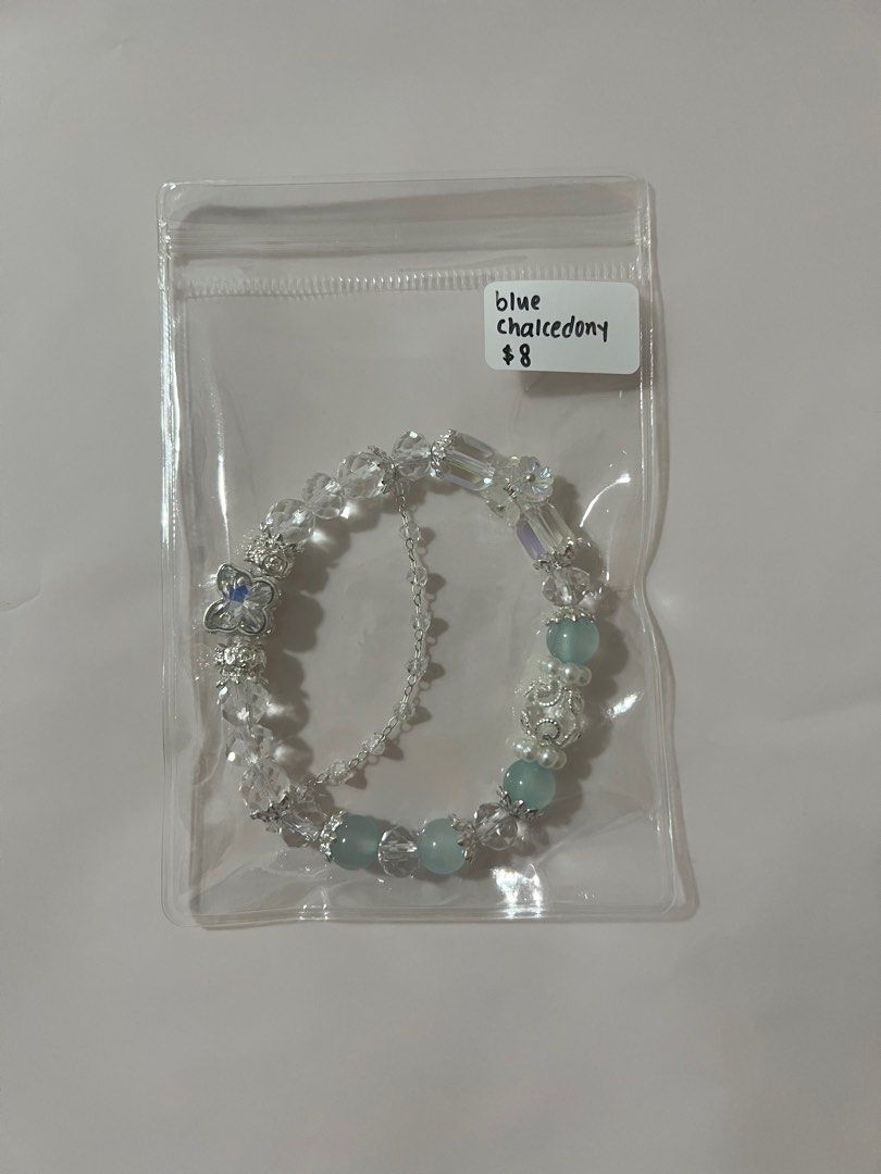Assorted Crystal Bracelets (Category: Bracelets) located in Singapore. Submitted by mykacx (Listing ID 1322874530, Image 3). Description: various crystal bracelets! price + crystal is on the bag :) more in the other listings! - slide 1: amethyst - slide 2: alashan - slide 3: blue chalcedony - slide 4: lepidolite - slide 5: rose quartz + selenite - slide 6: flower agate - slide 7: rose quartz - slide 8: sakura rhodonite + labradorite - slide 9: ro