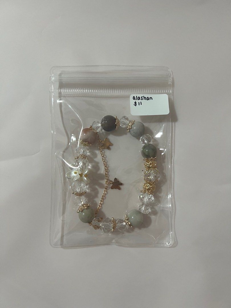 Assorted Crystal Bracelets (Category: Bracelets) located in Singapore. Submitted by mykacx (Listing ID 1322874530, Image 2). Description: various crystal bracelets! price + crystal is on the bag :) more in the other listings! - slide 1: amethyst - slide 2: alashan - slide 3: blue chalcedony - slide 4: lepidolite - slide 5: rose quartz + selenite - slide 6: flower agate - slide 7: rose quartz - slide 8: sakura rhodonite + labradorite - slide 9: ro