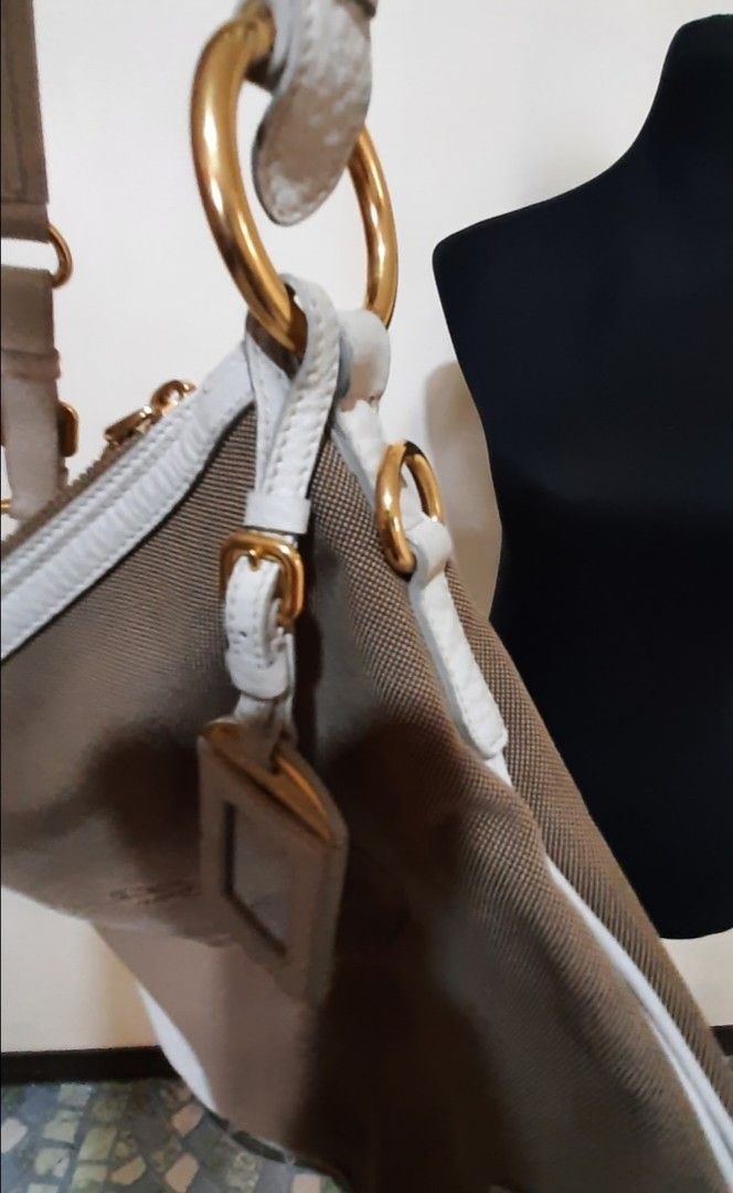 Prada Shoulder bag (Category: Luxury Bags & Wallets) located in Marikina City. Submitted by laila15 (Listing ID 1322786042, Image 2). Description: No sling inclusion may konting stain sa canvas Available.