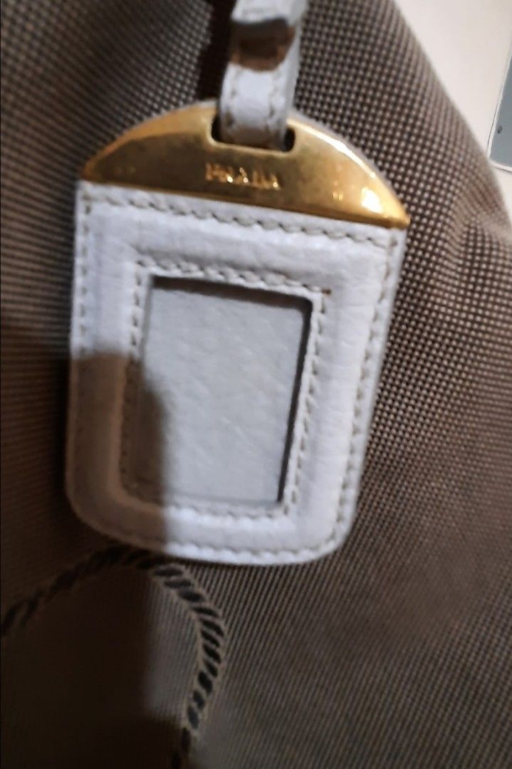 Prada Shoulder bag (Category: Luxury Bags & Wallets) located in Marikina City. Submitted by laila15 (Listing ID 1322786042, Image 3). Description: No sling inclusion may konting stain sa canvas Available.