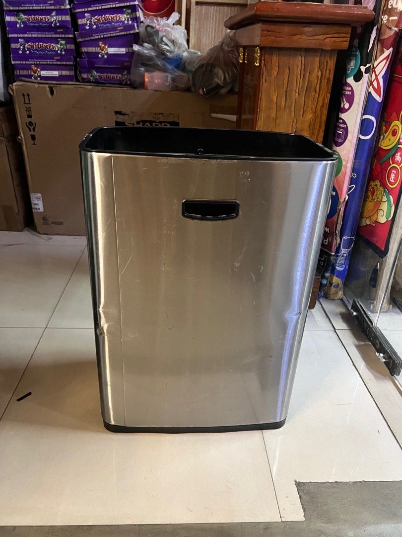 Stainless Trash Bin with small dents (Category: Storage Boxes & Baskets) located in Pasay City. Submitted by meostore (Listing ID 1322764149, Image 1). Description: 24 inch height 17 inch length 12 inch width.