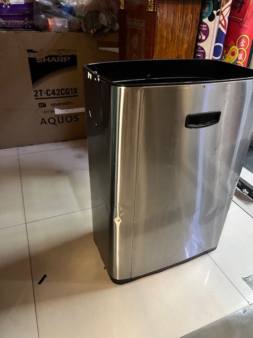 Stainless Trash Bin with small dents (Category: Storage Boxes & Baskets) located in Pasay City. Submitted by meostore (Listing ID 1322764149, Image 2). Description: 24 inch height 17 inch length 12 inch width.
