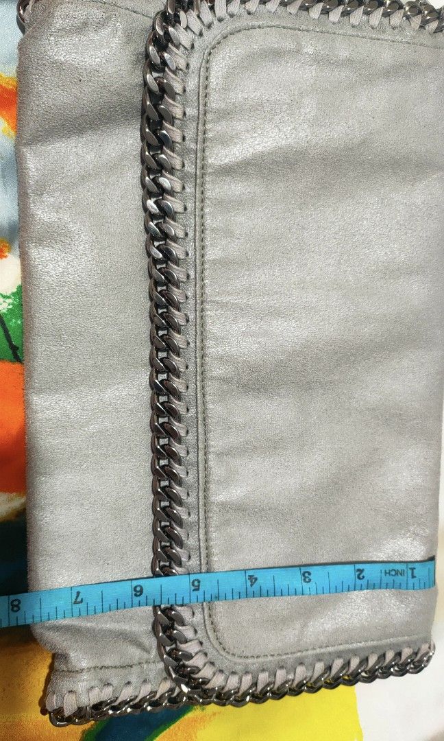 Stella McCartney clutch bag (Category: Clutches) located in Pasig City. Submitted by teacup12933 (Listing ID 1322825074, Image 2). Description: No sling included. Huge. Comes with cards only as seen in photos. Bought here in carousell from a reputable seller. This is a preloved item. Please manage your expectations. Bawal sa maselan please. Prefers meet up in Capitol Commons Kapitolyo Pasig so buyer can check actual item before buying. No return 