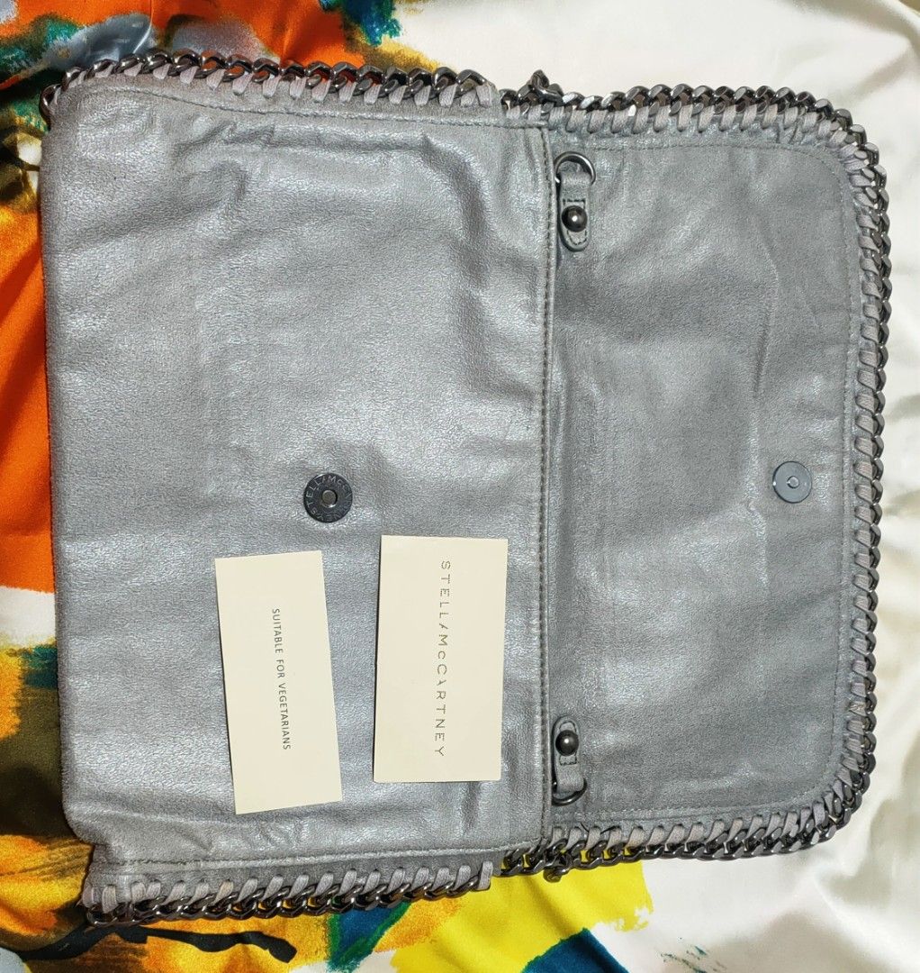 Stella McCartney clutch bag (Category: Clutches) located in Pasig City. Submitted by teacup12933 (Listing ID 1322825074, Image 3). Description: No sling included. Huge. Comes with cards only as seen in photos. Bought here in carousell from a reputable seller. This is a preloved item. Please manage your expectations. Bawal sa maselan please. Prefers meet up in Capitol Commons Kapitolyo Pasig so buyer can check actual item before buying. No return 